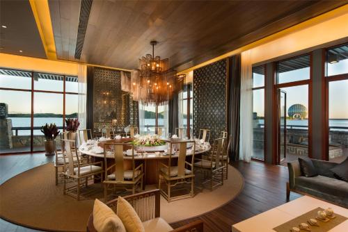 a dining room with a table and chairs at Yanqi Hotel, Managed by Kempinski in Huairou