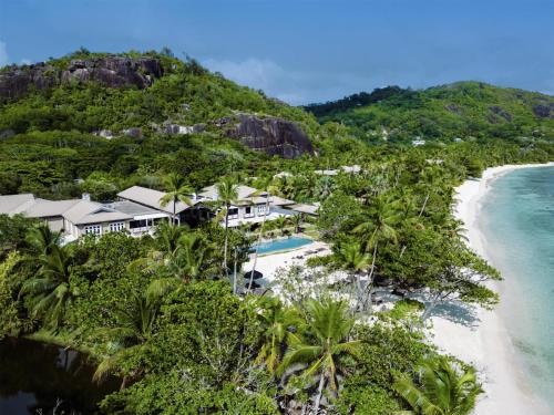 an aerial view of a resort on a beach at Kempinski Seychelles Resort in Baie Lazare Mahé