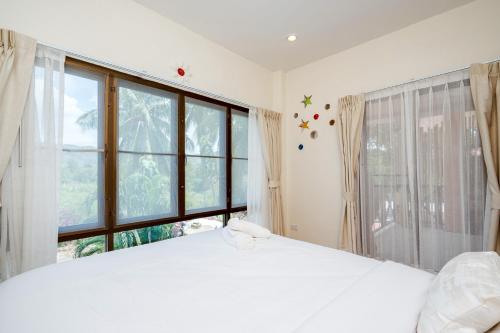 Postel nebo postele na pokoji v ubytování I-DAO POOLVilla HUAHIN วิวภูเขา&ใกล้ทะเลใกล้เมือง