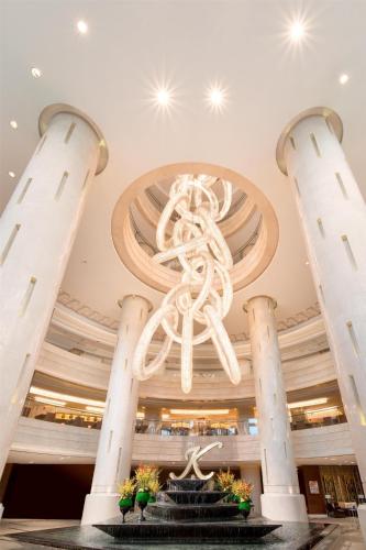 a chandelier in the lobby of a building at Kempinski Hotel Taiyuan in Taiyuan