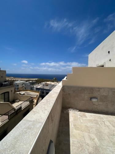 a view from the balcony of a building at Seaview Penthouse Xlendi in Xlendi