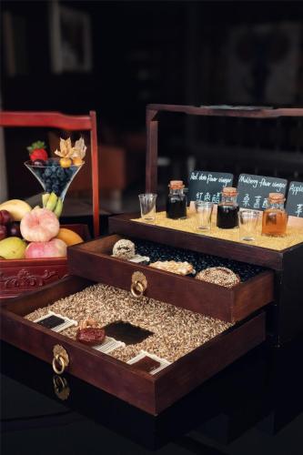 a wooden box filled with different types of food at Kempinski Hotel Taiyuan in Taiyuan