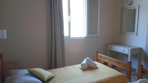 Katil atau katil-katil dalam bilik di Gorgona apartments & studios