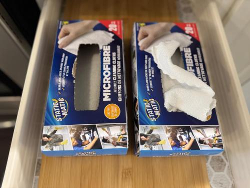 two packages of toilet paper sitting on a shelf at Heart of Port Credit, Lakefront, Dining & Shopping in Mississauga