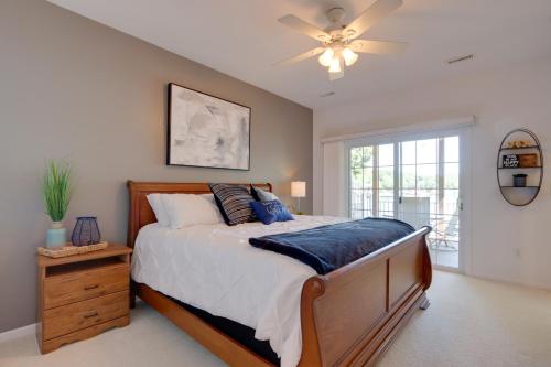 a bedroom with a bed and a ceiling fan at Private Dock and 4 Decks Lake Ozark Retreat! in Gravois Mills