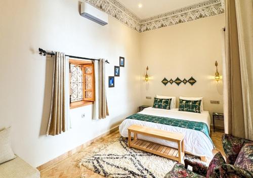 Ein Bett oder Betten in einem Zimmer der Unterkunft Riad Dar Timrad