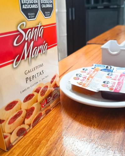 a box of santa marina cookies next to a plate with a box at Hotel Interlagos in San Juan