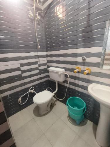 a bathroom with a toilet and a sink at KD Dham family Stay near by Prem Mandir in Vrindāvan