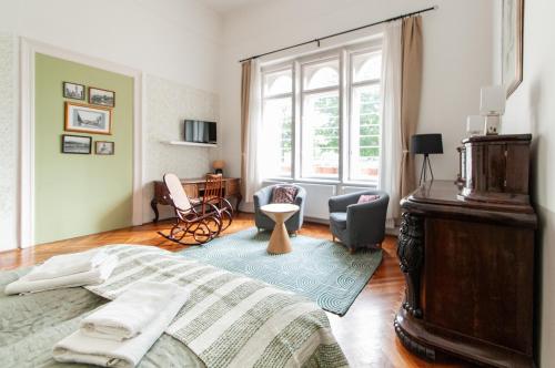 Televízia a/alebo spoločenská miestnosť v ubytovaní BudaFlats Apartments