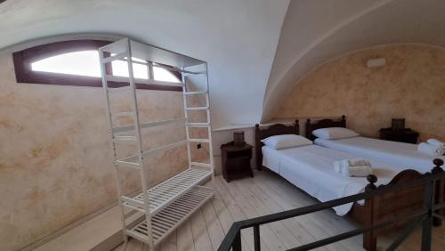 Postel nebo postele na pokoji v ubytování Buen Retiro - Casa Vacanze