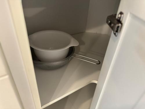 a bathroom door with a bowl in a cabinet at Heart of Port Credit, Lakefront, Dining & Shopping in Mississauga