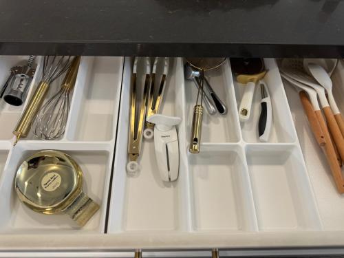 a drawer filled with utensils in a kitchen at Heart of Port Credit, Lakefront, Dining & Shopping in Mississauga