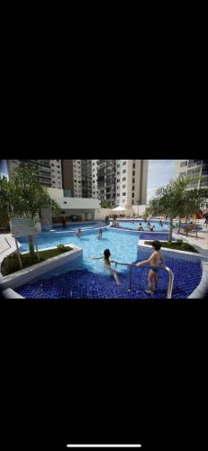 a group of people playing in a swimming pool at Bastos e Silva in Caldas Novas