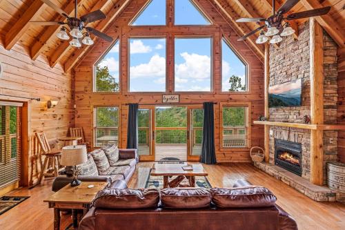 a living room with a couch and a fireplace at Mountain Wonderland by Avada Properties in Sevierville