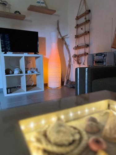 a vase sitting on a table next to a microwave at Casa Mareal in Paliouri