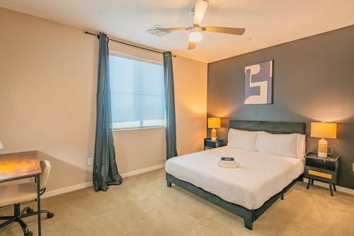 a bedroom with a bed and a large window at Convenient 1BR Uptown Biltmore Gym Pool Parking in Phoenix
