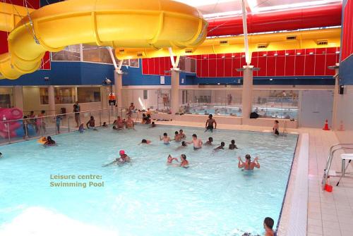 a group of people in a swimming pool at cozy rooms or entire Townhouse in London, close to Tottenham Hotspur Stadium in London
