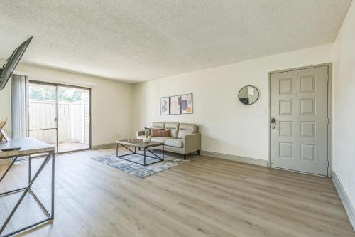an empty living room with a couch and a table at Rosehill Pointe 55 I Spacious 1 Bed 1 Bath in Lenexa