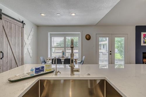 a kitchen with a counter top with a sink at Family-Friendly 3BR w Private Pool & BBQ in SW Austin in Bee Cave