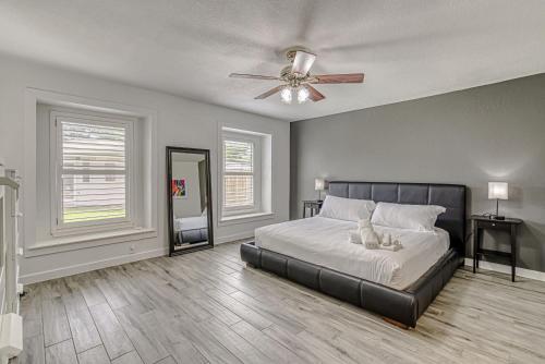 a bedroom with a bed and a ceiling fan at Family-Friendly 3BR w Private Pool & BBQ in SW Austin in Bee Cave