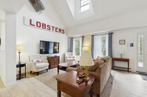 a living room with a couch and a table at Island Pines in Southport