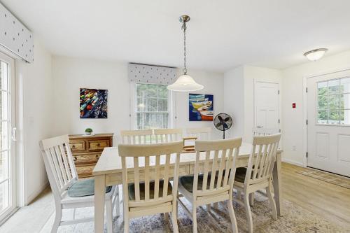 a dining room with a table and chairs at Island Pines in Southport