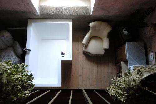 a room with a white door and some plants at Palmento Milo Agriproduction in Milo