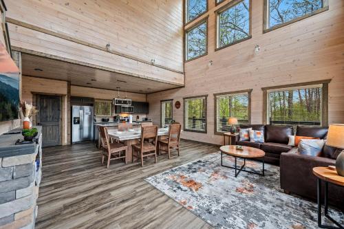 a living room with a couch and a table at Mountain Bliss by Avada Properties in Sevierville