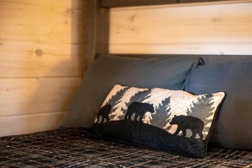 a pillow with horses on it sitting on a couch at Mountain Bliss by Avada Properties in Sevierville