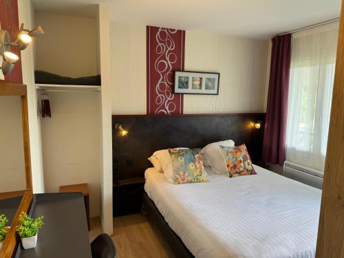 Postel nebo postele na pokoji v ubytování Hotel Capricorne