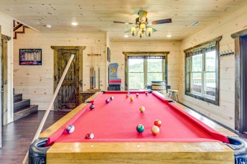 a red pool table in a room with a ceiling at Misty Mountain Stop by Avada Properties in Pigeon Forge