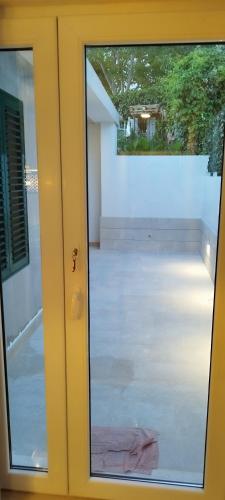 a sliding glass door with a view of a patio at House Lipo in Makarska