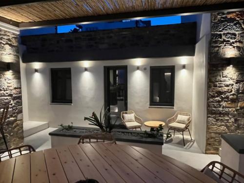 a dining room with a wooden table and chairs at Venetian gem in neapolitan with private courtyard in Neápolis