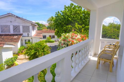 a balcony with a view of a yard at Urban Oasis Apartments in Mombasa