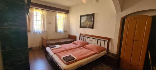 Postel nebo postele na pokoji v ubytování Penzion Vysehrad NonStop