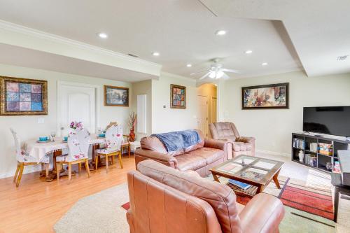 a living room with a couch and a table at 6 Mi to Grove Creek Canyon Trail Abode with Views in American Fork