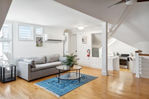 a living room with a couch and a table at The Inn at 257 in Charleston