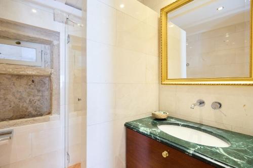 a bathroom with a sink and a mirror at Luxury Villa In the Old Town with Stunning Views in Dubrovnik
