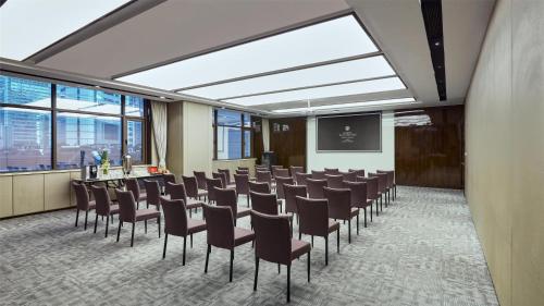 a conference room with a bunch of chairs in it at Kempinski The One Suites Hotel Shanghai Downtown in Shanghai