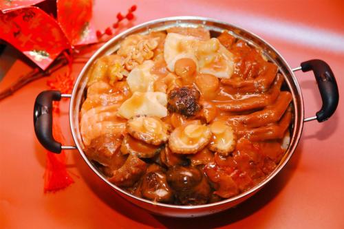 a pan full of food on a table at Kempinski Hotel Xiamen in Xiamen