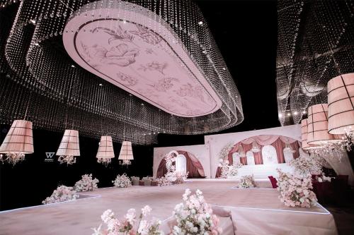 a large room with a table with flowers on it at Kempinski Hotel Xiamen in Xiamen