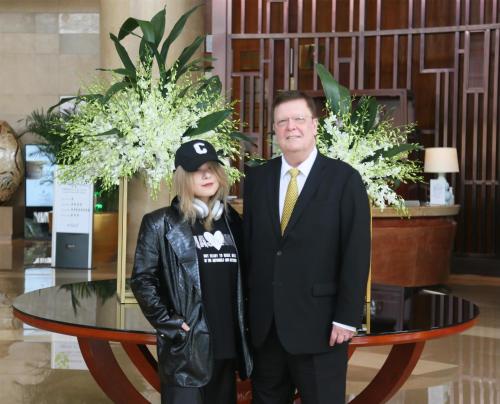 a man and a woman standing in front of a table at Kempinski Hotel Xiamen in Xiamen