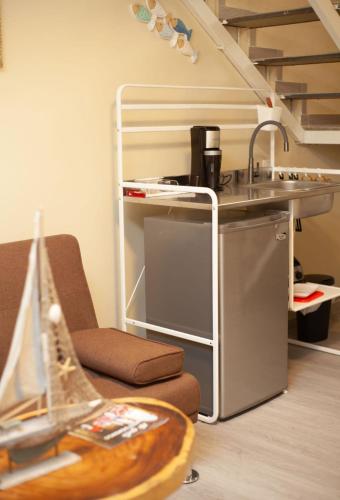 a kitchen with a sink and a counter with a sink at JM GUESTHOUSE Colonial in Santo Domingo