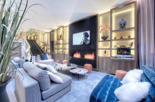 a living room with couches and a fire place at Best Western Plus Nice Cosy Hotel in Nice