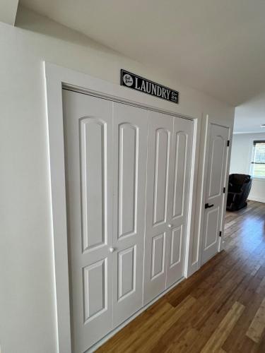 a room with a garage door with a sign on it at Catskills Escape Hot Tub Massage Chairs & Games in Round Top