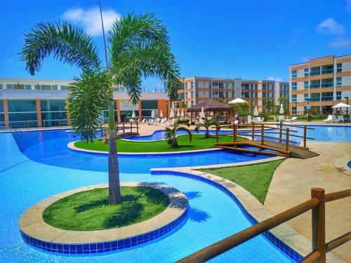 Bazén v ubytování Porto de galinhas flats muro alto nebo v jeho okolí