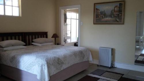 Ένα ή περισσότερα κρεβάτια σε δωμάτιο στο Margaret's Place