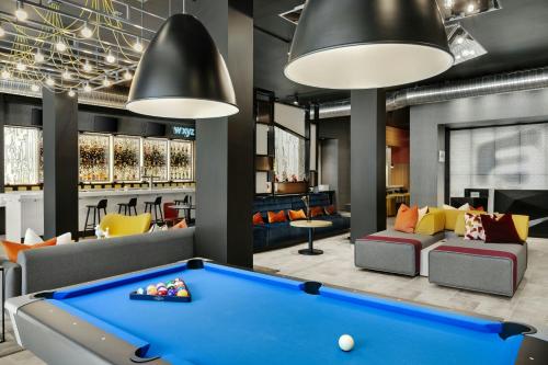 a billiard room with a pool table at Aloft Indianapolis Downtown in Indianapolis