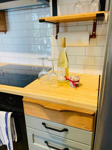 a bottle of wine sitting on a counter in a kitchen at Villa Edem in Khalikerí