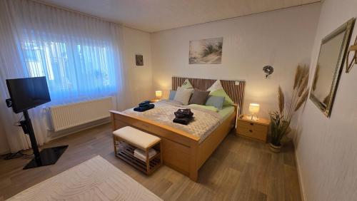 Postel nebo postele na pokoji v ubytování Ferienwohnung Ernebibbel